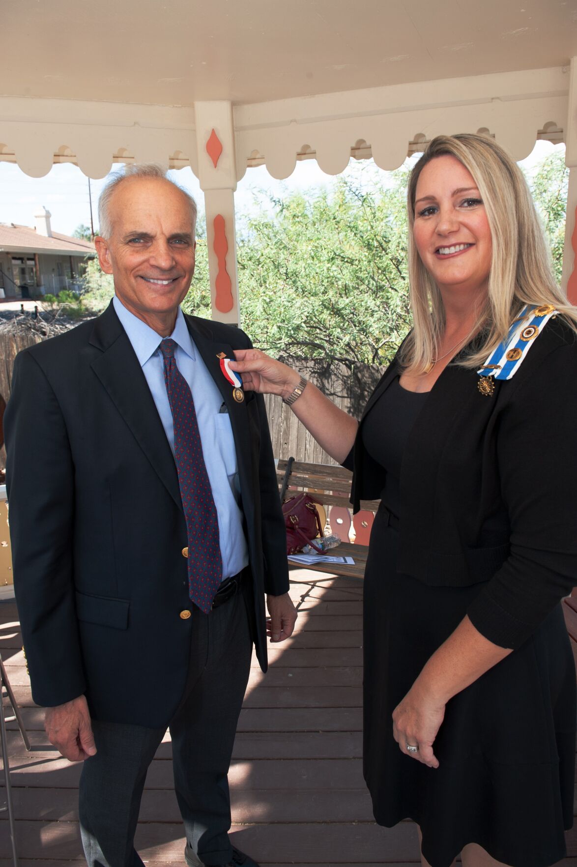 The Black Mountain Foothills Chapter Regent, Molly Zehnder, is pictured pinning John Crane with the Medal of Honor